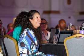 Paralegal Conference 2024 woman smiling blue dress.jpg