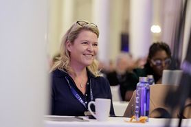 SC25 Blonde woman smiling audience.jpg