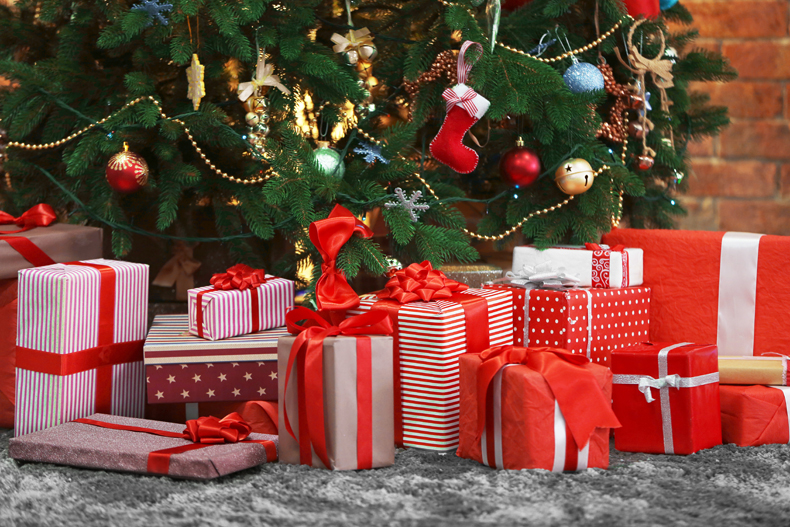 image of red and white wrapped presents under a christmas tree