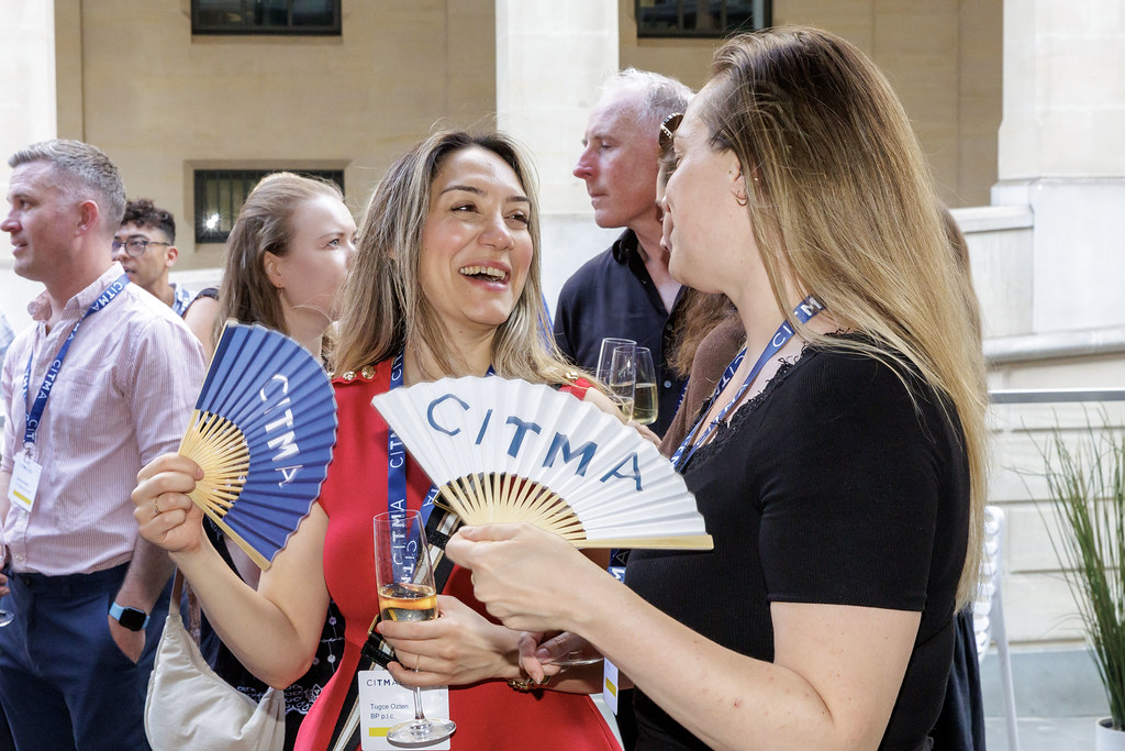 SR26 women with fans laughing.jpg