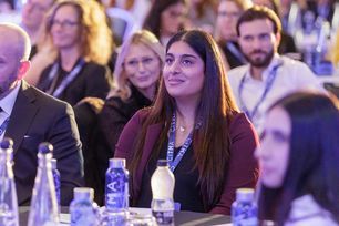 PC26 Sophia Kapur sitting at table.jpg