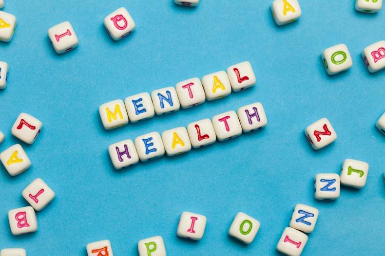 Letter cubes spelling out mental health