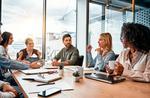 People sitting round table stock image.jpg