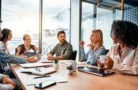 People sitting round table stock image.jpg