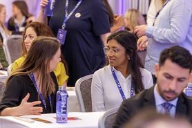SC25 Two delegates talking at table.jpg