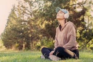 Wellbeing - woman listening to music stock.jpg