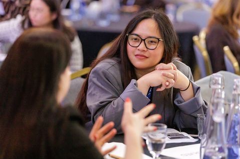 PC25 woman sitting at table talking.jpg