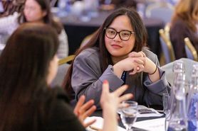 PC25 woman sitting at table talking.jpg