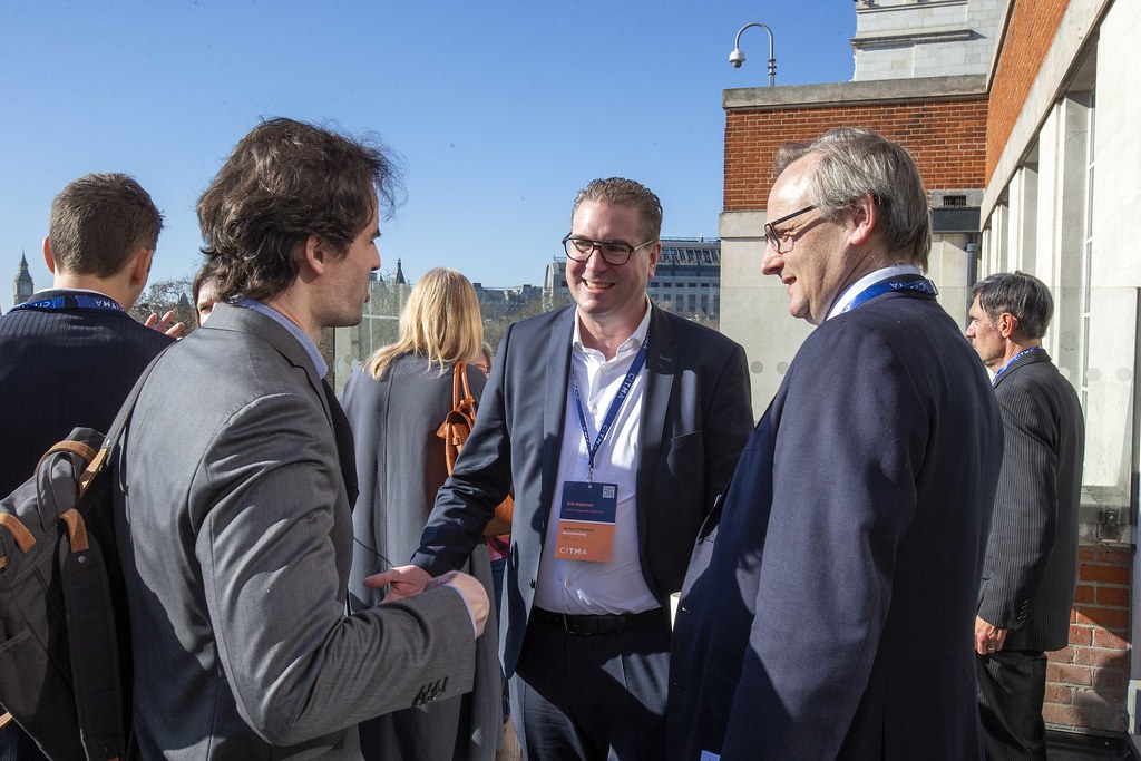 Three men on terrace.jpg