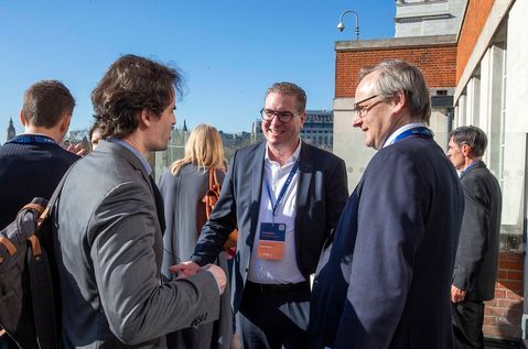 Three men on terrace.jpg