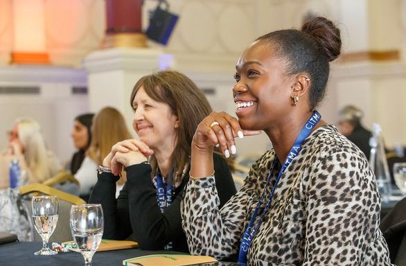 Paralegal Conference 2024 - Women smiling at table.jpg