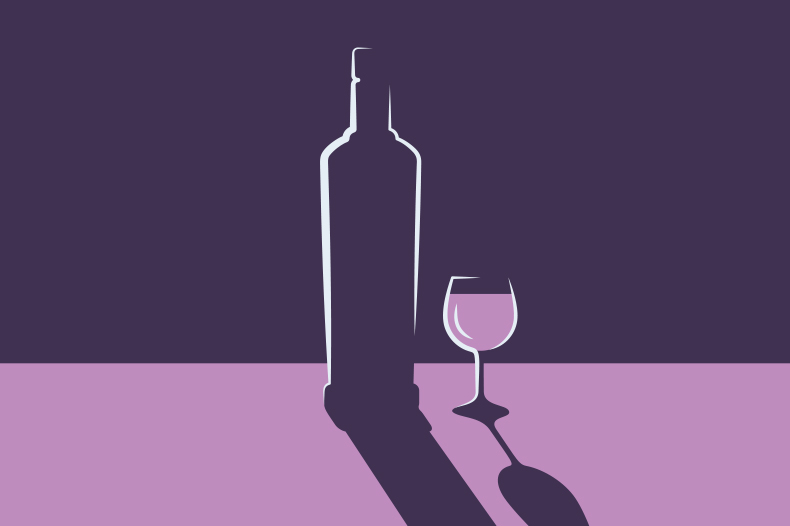 bottle and glass on purple background