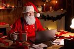 santa looking at his laptop