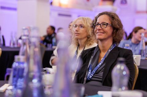 PC25 Woman smiling at table.jpg