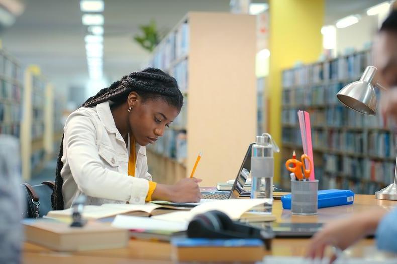 Brand school blog - student in library.jpg