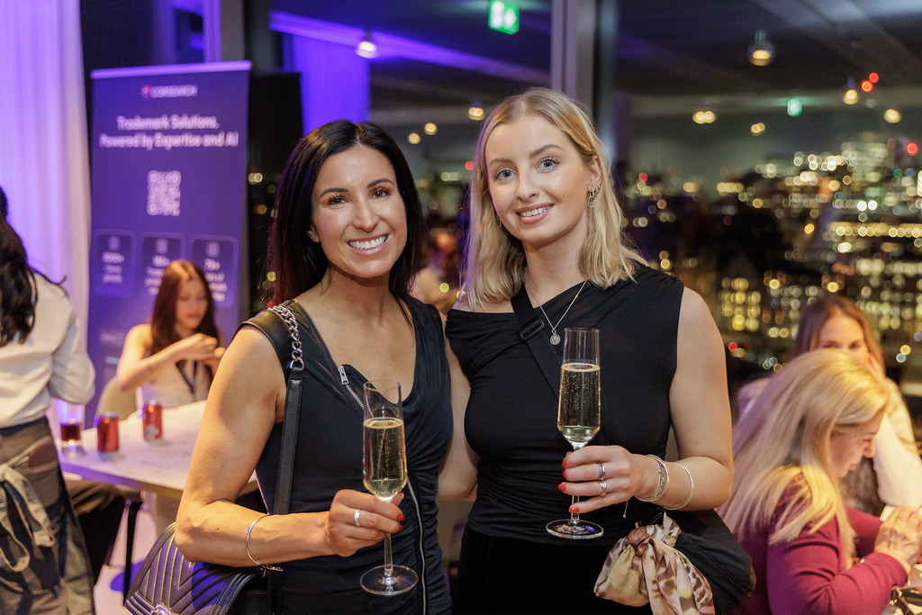SC26 two women with drinks at Spring Party.jpg