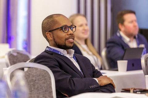 SC25 - Man listening in audience.jpg