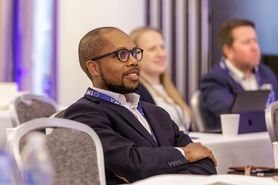 SC25 - Man listening in audience.jpg