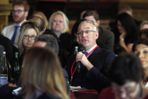 Spring Conference audience with microphone