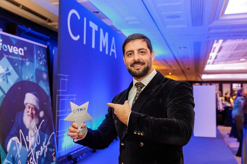 LCL25 Azhar pointing to award.jpg