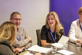 SC26 group talking at table.jpg