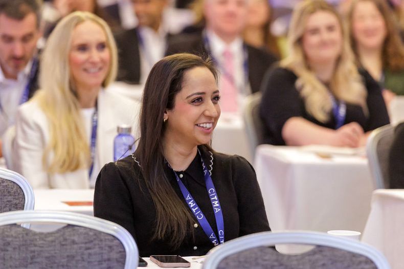 SC25 woman smiling in audience.jpg